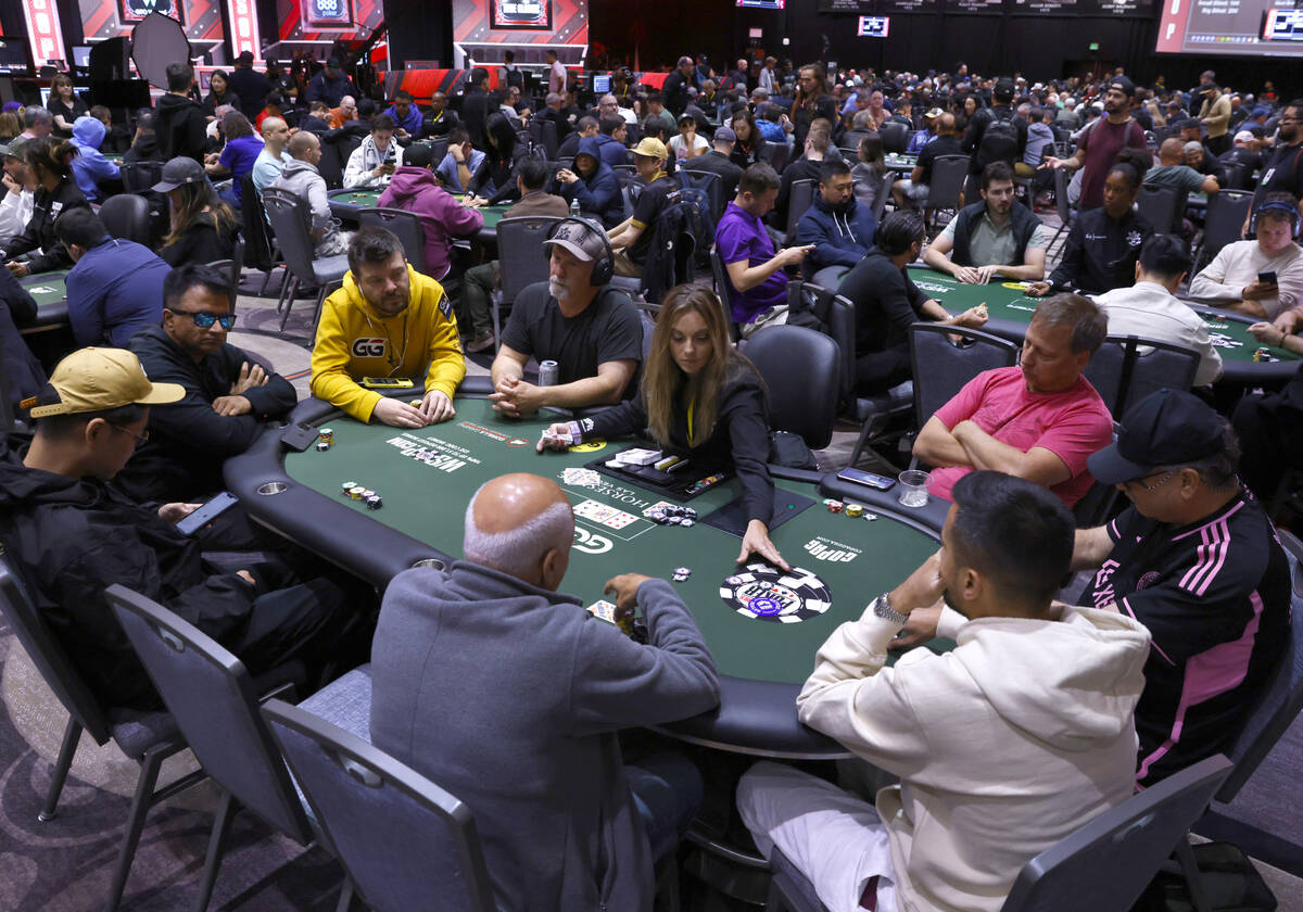 People participate during the first day of the World Series of Poker Main Event at Horseshoe ho ...