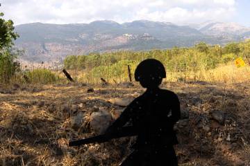 A soldier shaped target lays near the border with Lebanon as seen from a position on the Israe ...