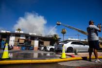 Clark County firefighters work to contain an apartment fire on Dumont Boulevard on Wednesday, J ...