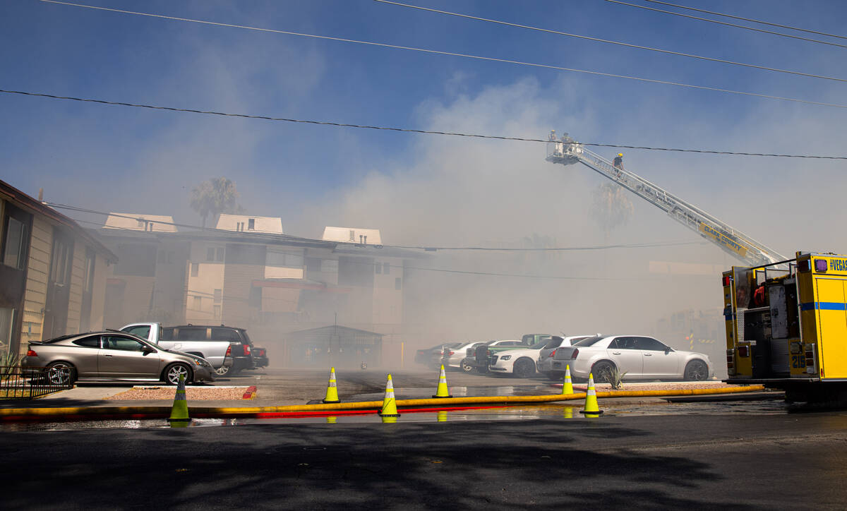 Clark County firefighters work to contain an apartment fire on Dumont Boulevard on Wednesday, J ...