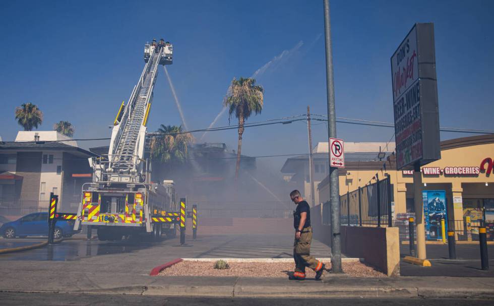 Clark County firefighters work to contain an apartment fire on Dumont Boulevard on Wednesday, J ...