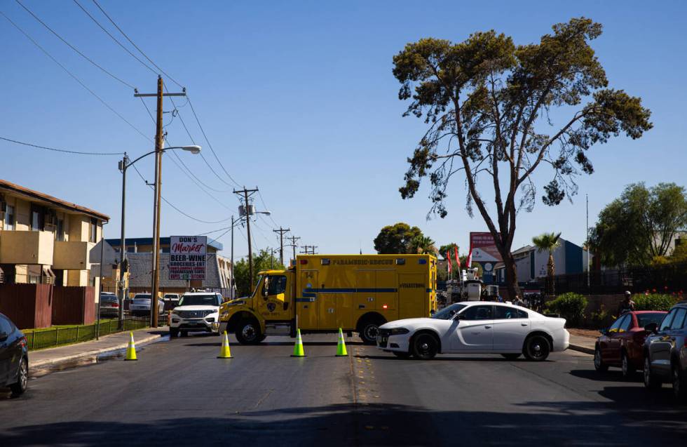 Traffic is blocked on Dumont Boulevard as Clark County firefighters work to contain an apartmen ...