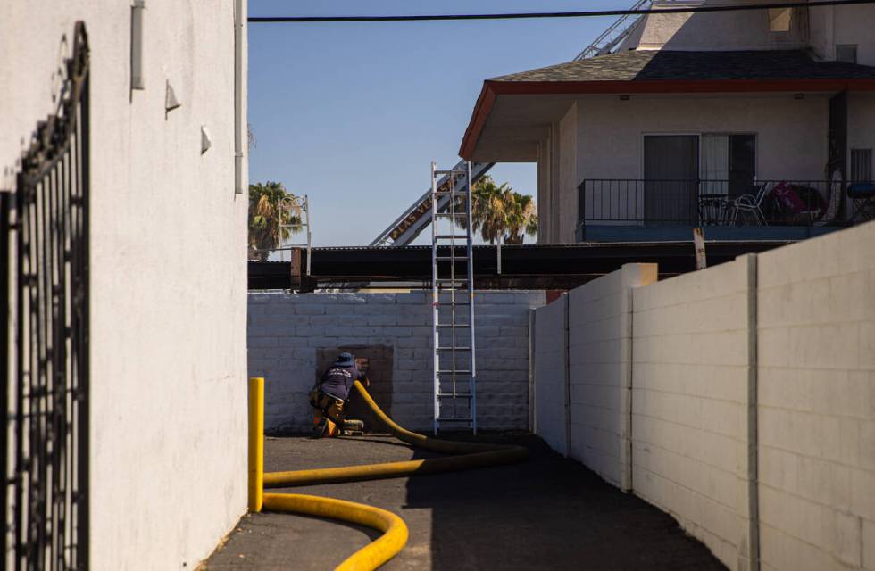 Clark County firefighters work to contain an apartment fire on Dumont Boulevard on Wednesday, J ...