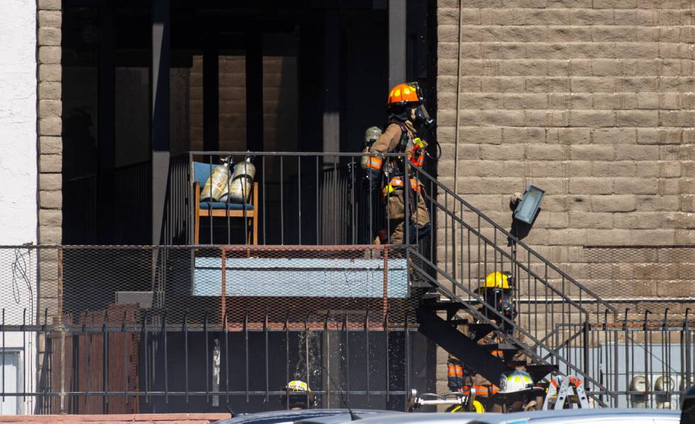 Clark County firefighters work to contain an apartment fire on Dumont Boulevard on Wednesday, J ...