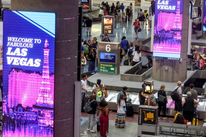 Guests in the baggage claim area of Harry Reid International Airport in Las Vegas, Wednesday, J ...