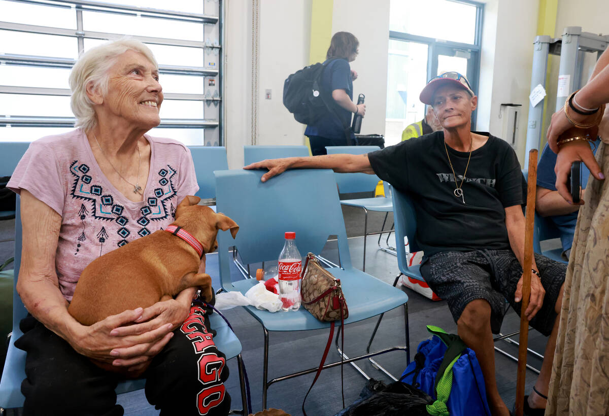 Esther Davis, 72, left, and Woodie Colbert, 64, beat the heat in a cooling station at the Court ...
