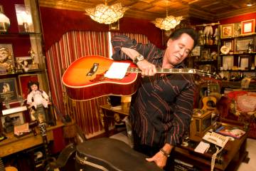 Wayne Newton holds a guitar, which was a gift from Elvis Presley, at Casa de Shenandoah ranch h ...