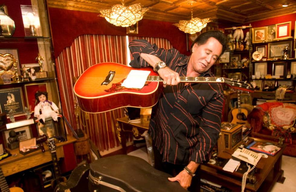 Wayne Newton holds a guitar, which was a gift from Elvis Presley, at Casa de Shenandoah ranch h ...