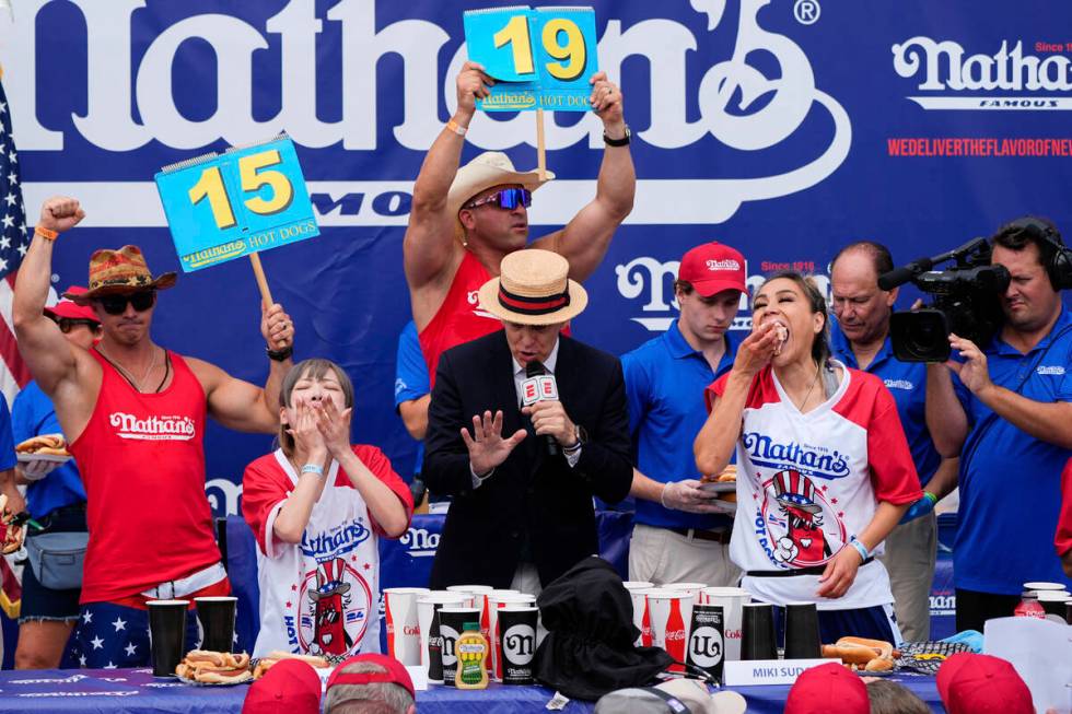 Miki Sudo, right, and Mayoi Ebihara, left, compete in the women's division of Nathan's Famous F ...