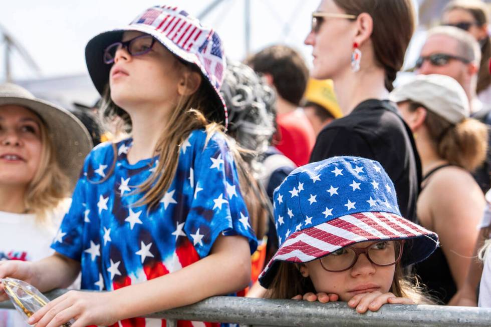 People wait for the Nathan's Famous Fourth of July hot dog eating contest to start, Thursday, J ...