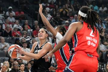 Las Vegas Aces guard Kelsey Plum (10) is defended by the Washington Mystics during the first h ...