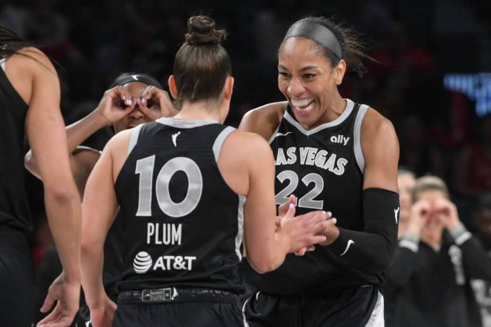 Las Vegas Aces guard Kelsey Plum (10) and center A'ja Wilson (22) celebrate a basket against th ...