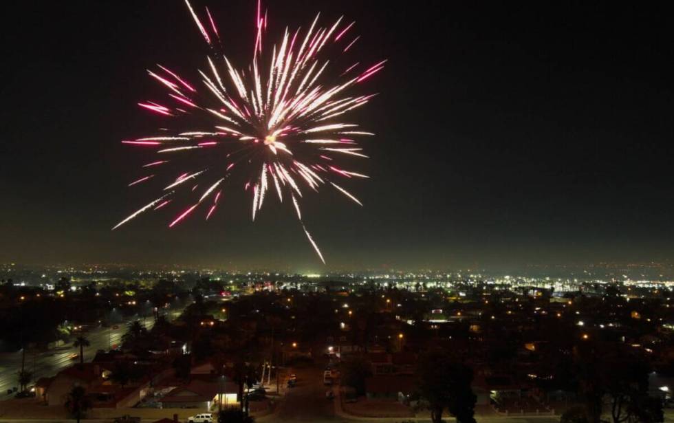 Fireworks explode over a neighborhood on the east side of Las Vegas Thursday, July 4, 2024. (Sa ...