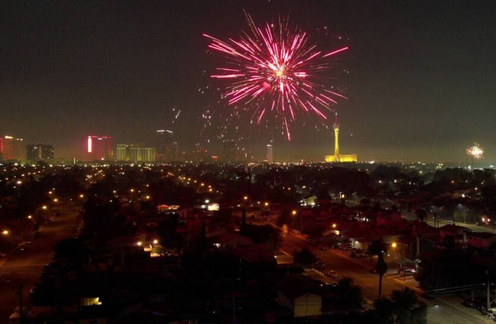 Fireworks explode over a neighborhood on the east side of Las Vegas Thursday, July 4, 2024. (Sa ...