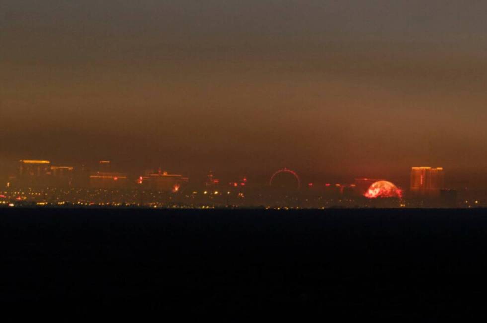 A haze begins to cover the Las Vegas skyline after numerous firework displays were fired off ac ...