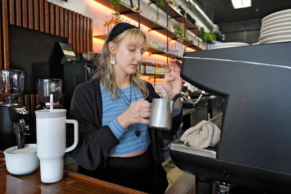 FILE - Samantha Grimison makes a cup of coffee at the Blind Tiger Cafe on Jan. 10, 2024, in Tam ...