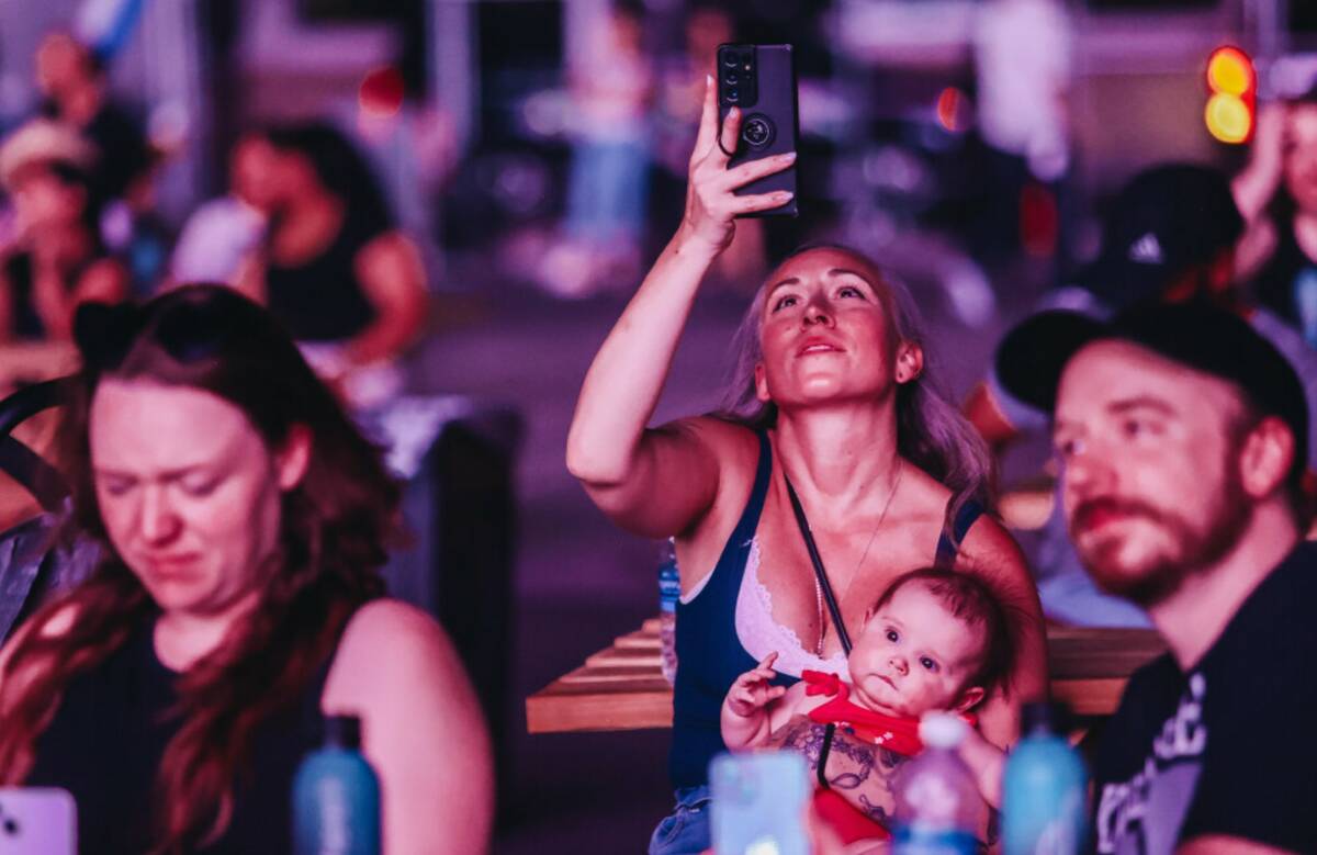 A spectator films at the Sphere on Thursday, July 4, 2024, in Las Vegas. (Madeline Carter/Las V ...