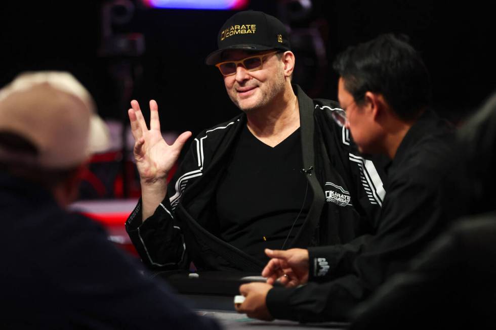 Phil Hellmuth converses at the table during the World Series of Poker main event at Horseshoe C ...