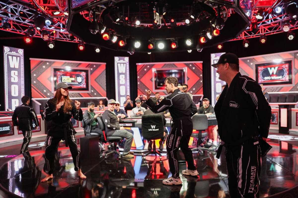 Phil Hellmuth, right, watches a fake fight between Shannon Elizabeth, left, and Dan Cates after ...