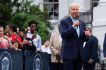 President Joe Biden speaks during a barbecue with active-duty military service members and thei ...