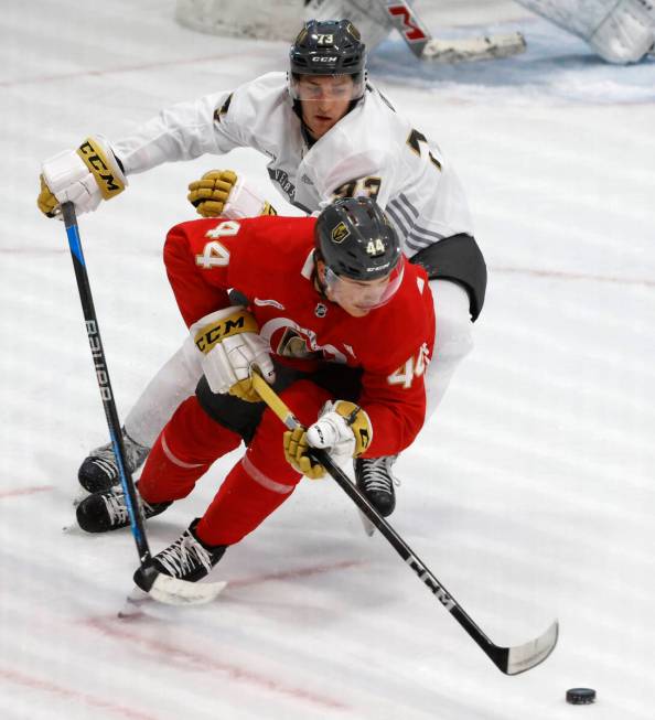 Golden Knights forward Will Dineen (73) chases defenseman Christoffer Sedoff (44) during team's ...