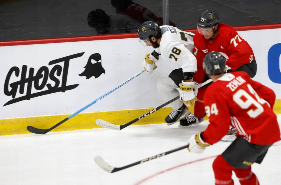 Golden Knights forwards Harrison Scott (78) Kai Uchacz (77) and defenseman Austin Zemlak (94) s ...