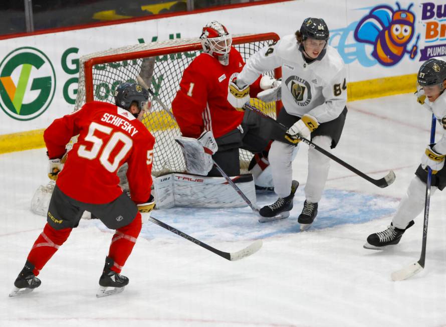 Golden Knights forward Jacob Mathieu (97) prepares to shoot the puck as goaltender Cameron Whit ...