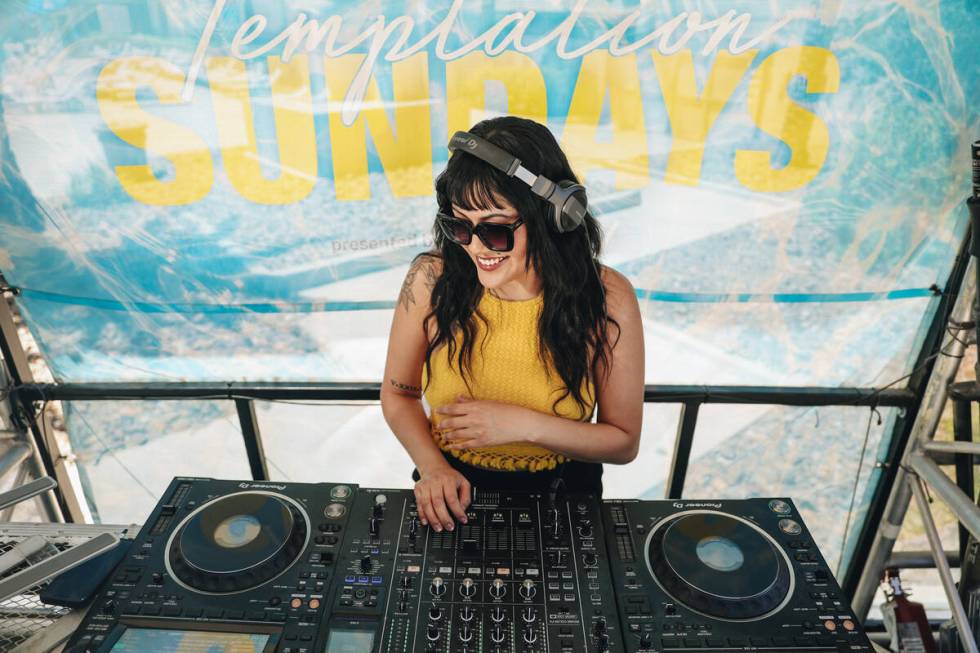 DJ Aravi DJs during Temptation Sundays, an LGBTQ+ pool party at the Luxor pool on Sunday, June ...