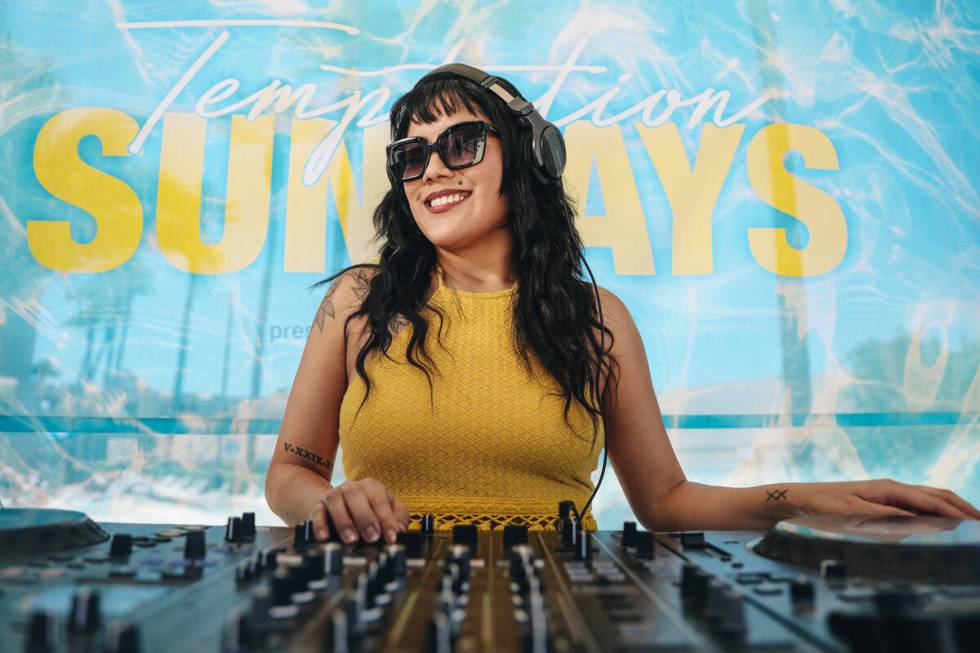 DJ Aravi DJs during Temptation Sundays, an LGBTQ+ pool party at the Luxor pool on Sunday, June ...