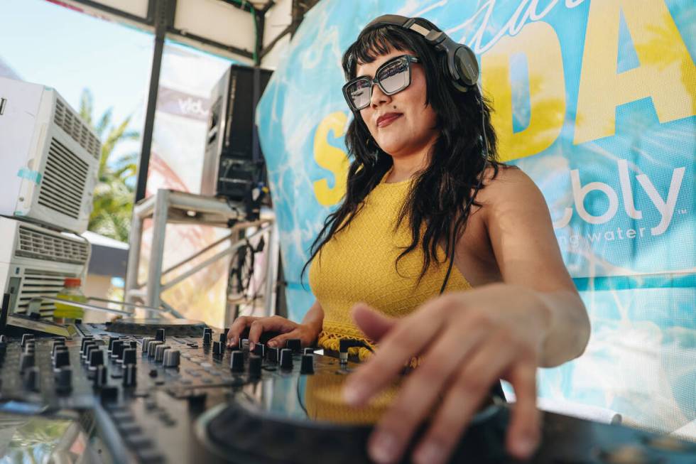 DJ Aravi DJs during Temptation Sundays, an LGBTQ+ pool party at the Luxor pool on Sunday, June ...