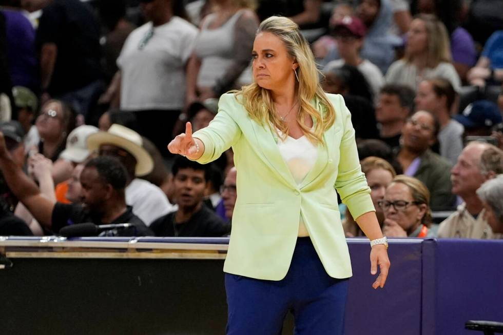 Las Vegas Aces head coach Becky Hammon gestures during the first half of a WNBA basketball game ...