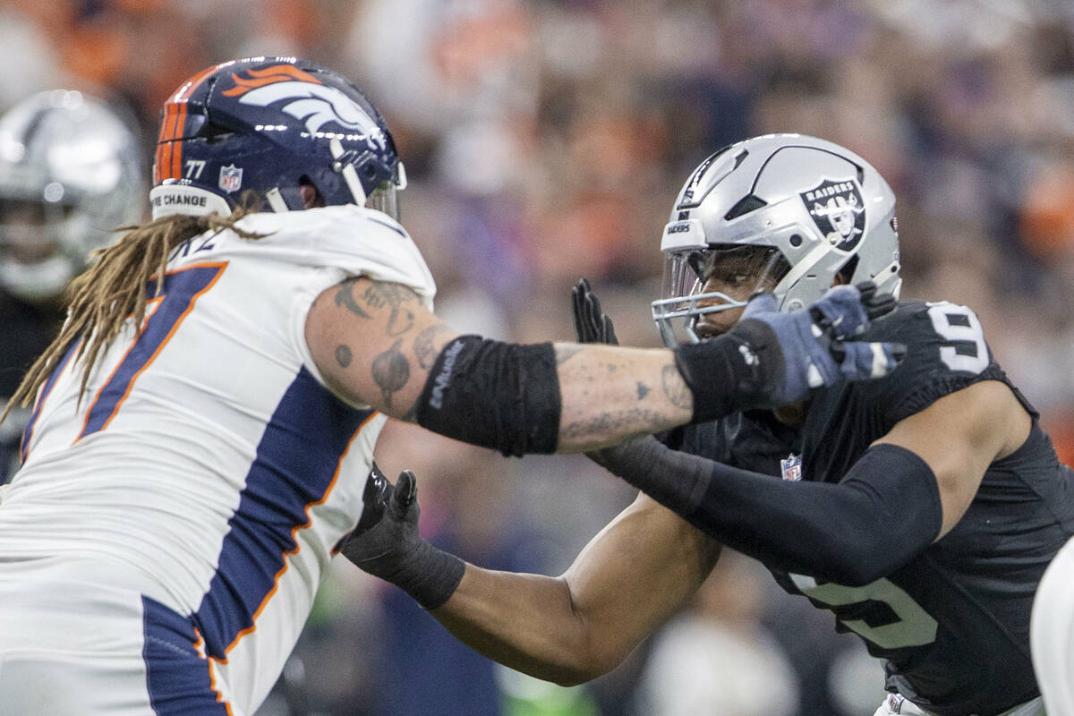 Raiders defensive end Tyree Wilson (9) works against Denver Broncos guard Quinn Meinerz (77) du ...