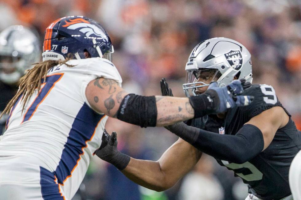 Raiders defensive end Tyree Wilson (9) works against Denver Broncos guard Quinn Meinerz (77) du ...