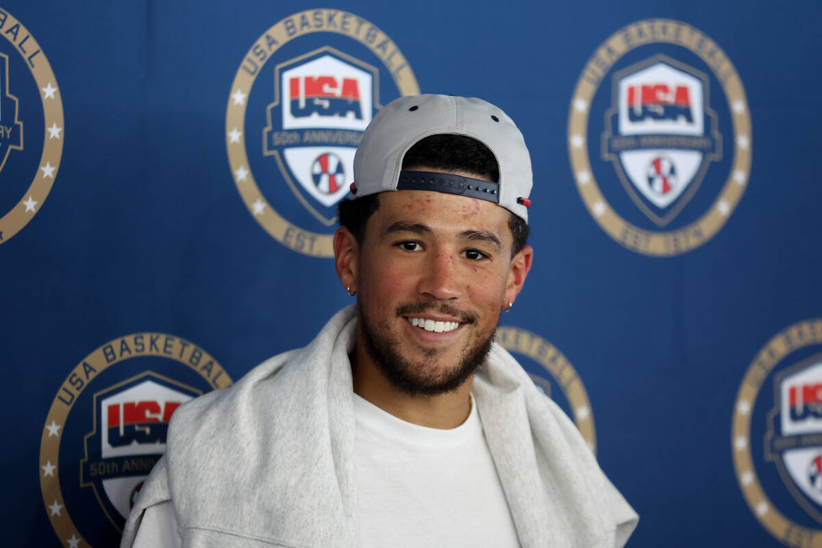 Phoenix Suns guard Devin Booker speaks in a news conference during training camp for the USA Ba ...