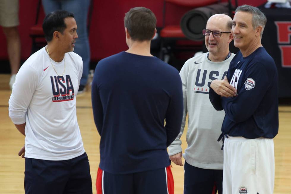 A group of coaches converse on the court during training camp for the USA Basketball Men&#x2019 ...