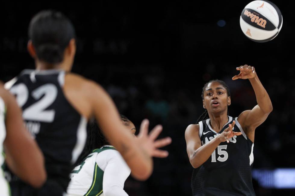 Las Vegas Aces guard Tiffany Hayes (15) passes to center A'ja Wilson (22) during the first half ...