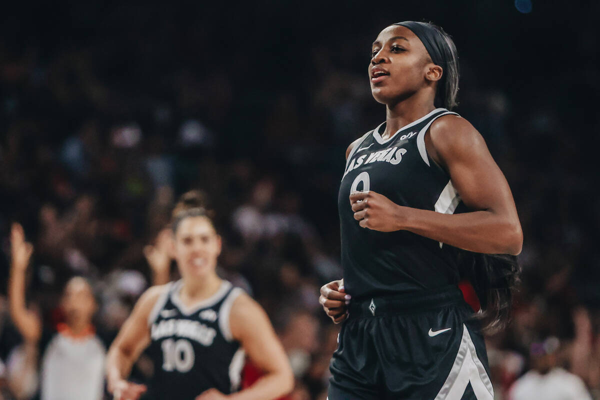 Aces guard Jackie Young (0) reacts after making a basket during a WNBA basketball game between ...