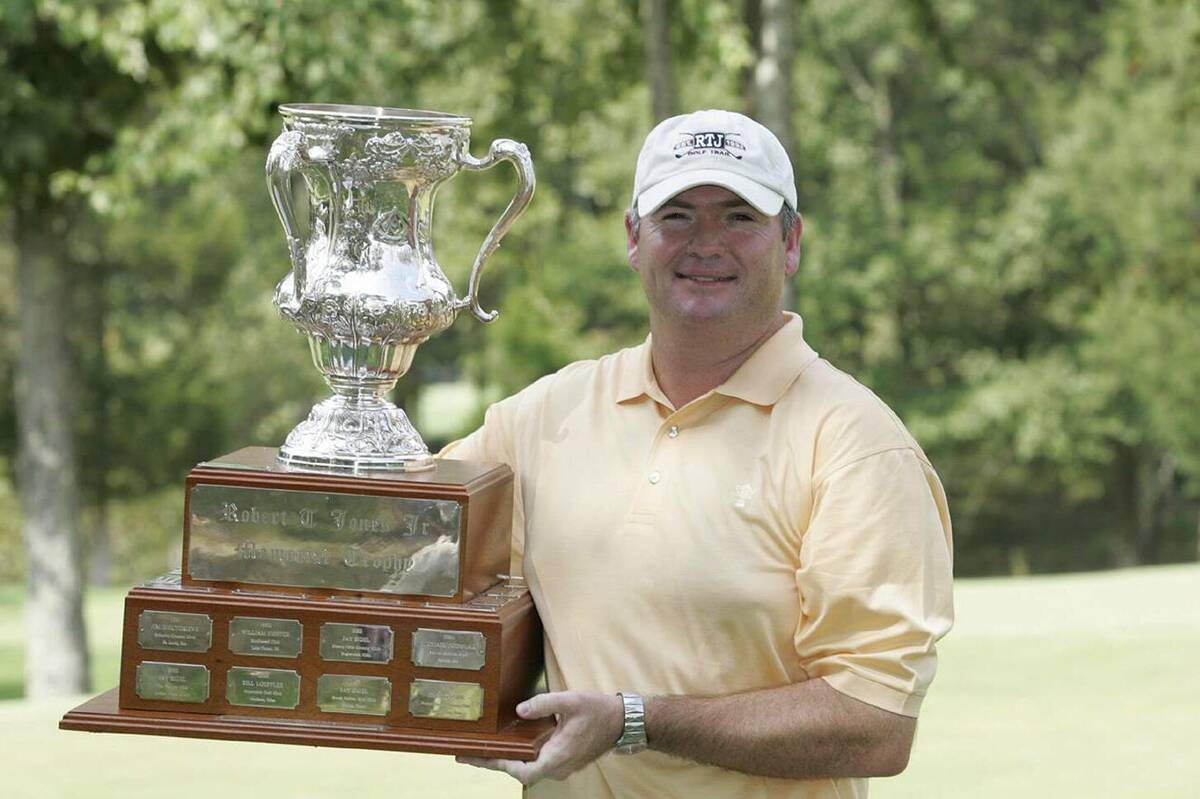 Kevin Marsh holds the trophy after winning the 2005 U.S. Mid-Amateur at the Honors Course in Oo ...