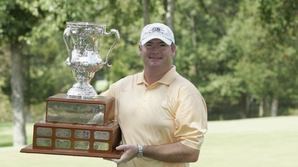 Kevin Marsh holds the trophy after winning the 2005 U.S. Mid-Amateur at the Honors Course in Oo ...