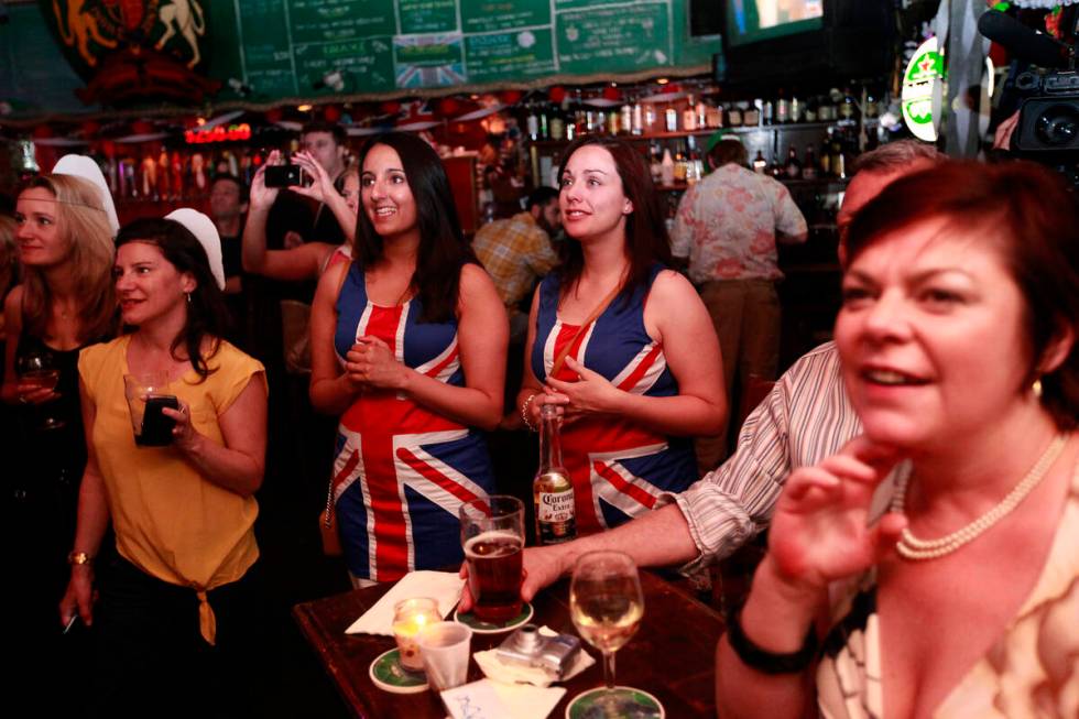 Aisha Arif, center left, and Laura Attwood, both of the United Kingdom, watch Kate Middleton ar ...