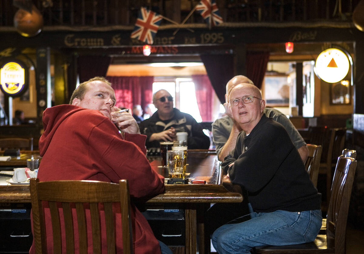 Allan Marks, 33, of England, left, "Scotty" Cameron, right, and Paul Marks, behind Ca ...