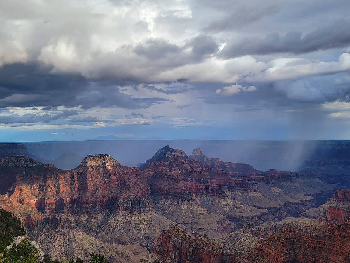 Sunset’s light, clouds and showers on view at the North Rim of Grand Canyon National Par ...