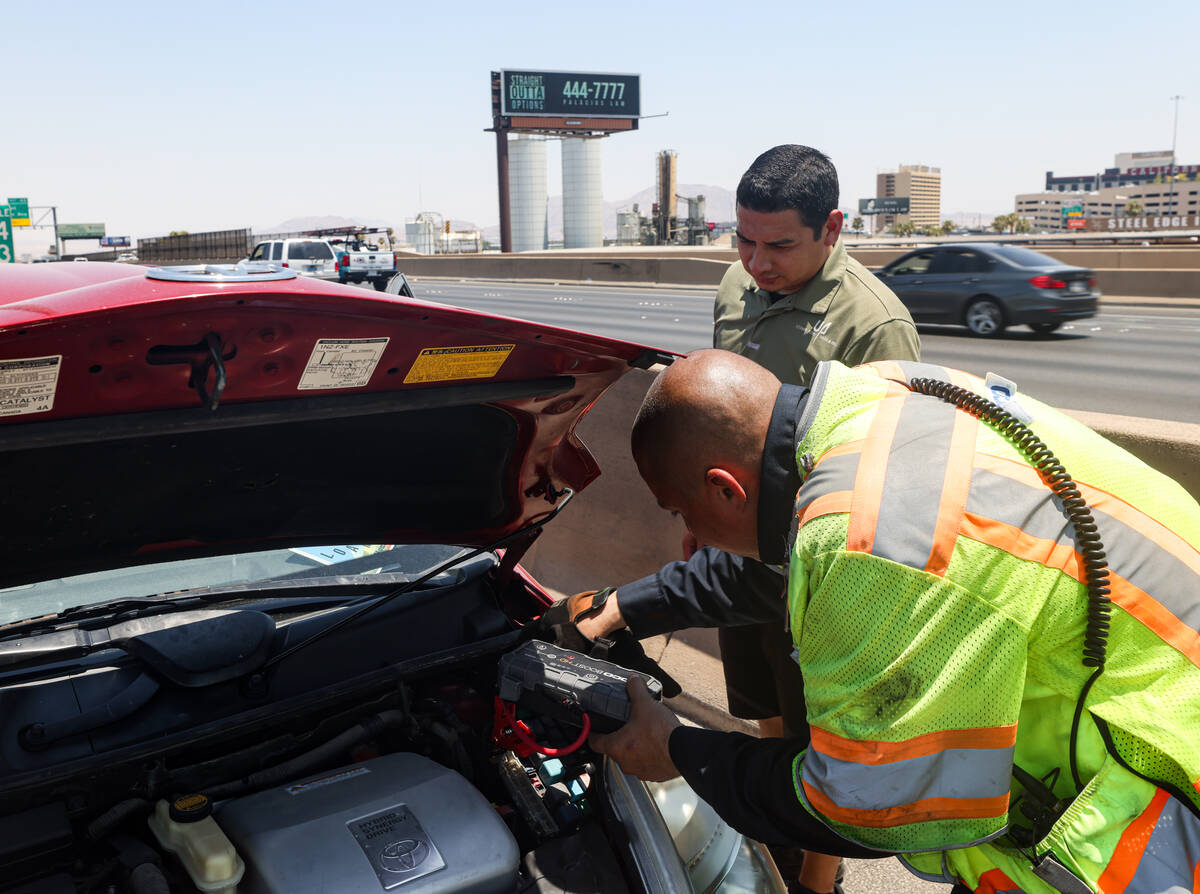 Stephen SanFilippo, supervisor for the Freeway Service Patrol, assists motorist Pablo Salcido ...