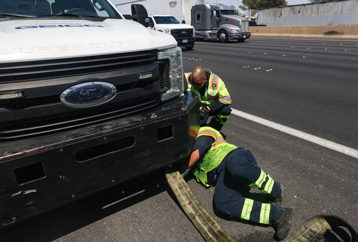 Stephen SanFilippo, supervisor for the Freeway Service Patrol, above, helps out his patrol ...