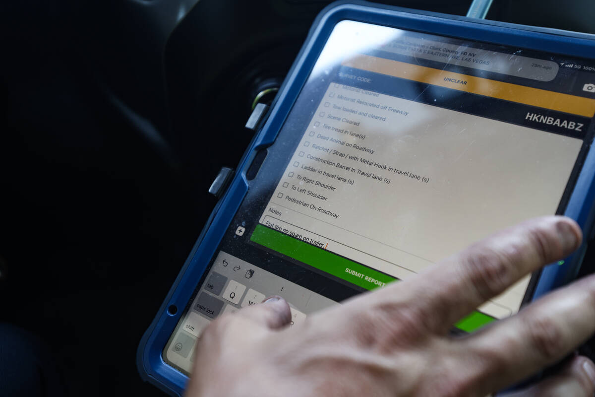 Stephen SanFilippo, supervisor for the Freeway Service Patrol, records the details of the ...