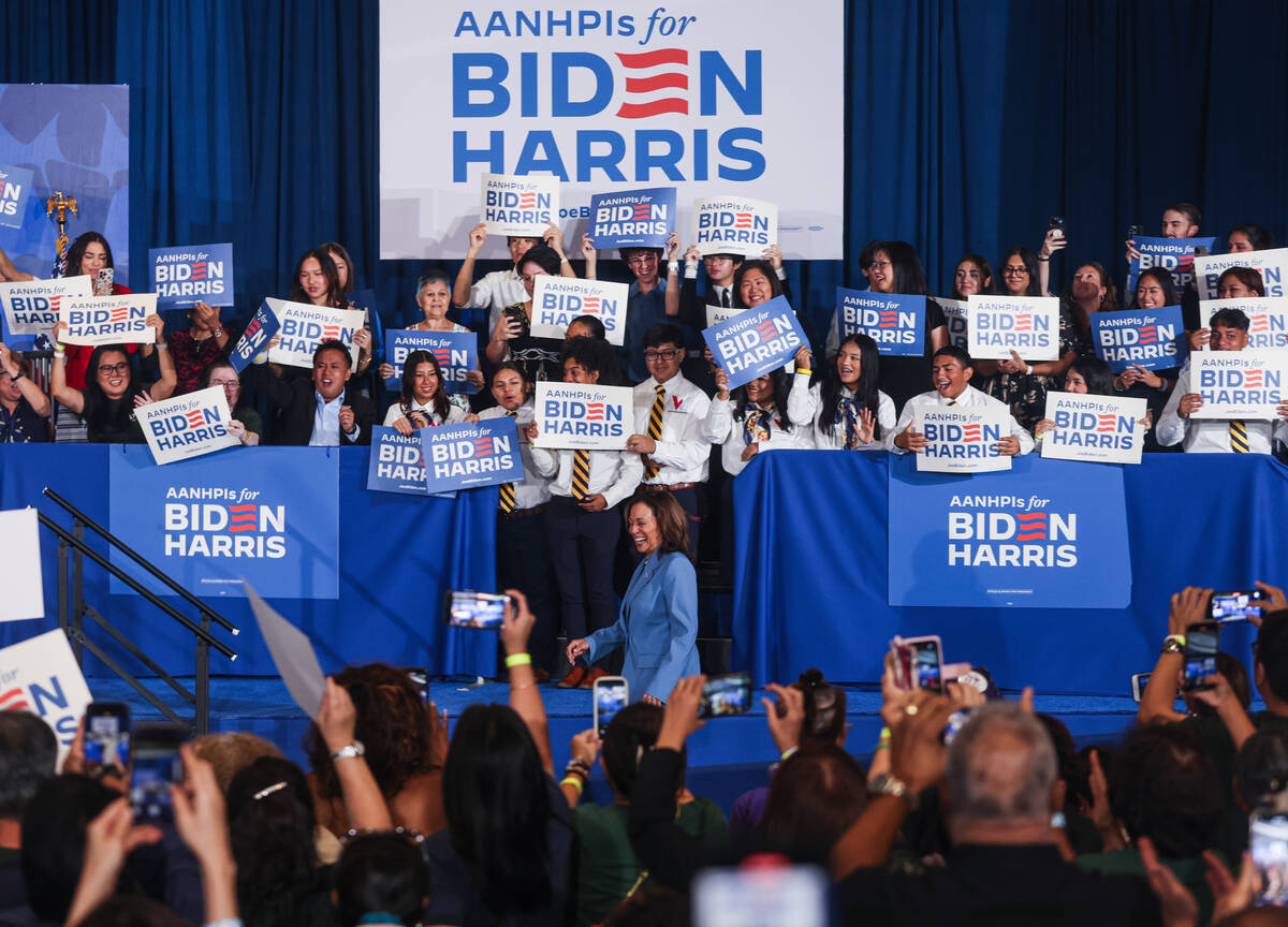 Vice President Kamala Harris enters the room to a cheering crowd at a campaign event at Resorts ...