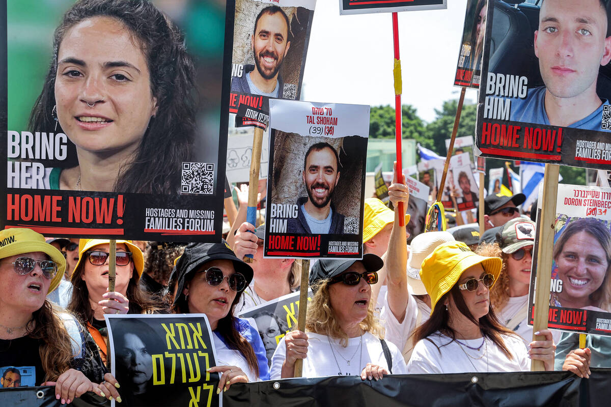 Demonstrators march during a protest by the mothers and relatives of Israelis held hostage by P ...