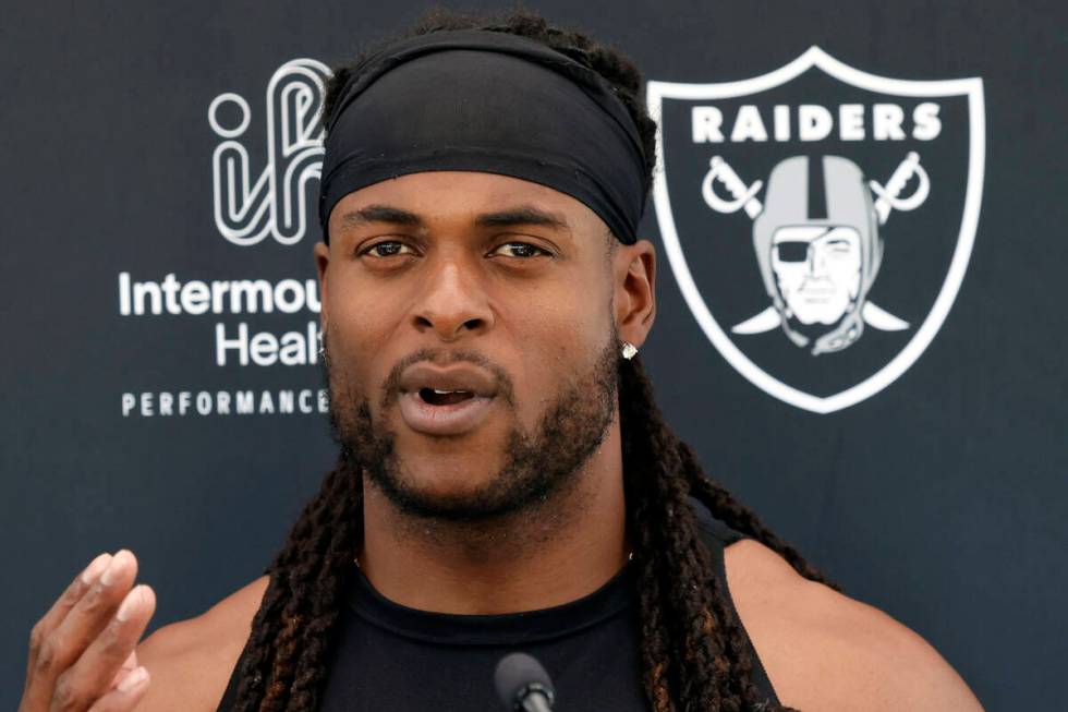 Raiders wide receiver Davante Adams addresses the media after an NFL football practice at the I ...