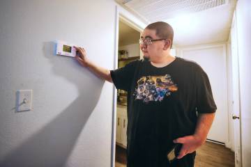 Jose Alvarez shows the theromstat inside of his apartment on Sunday, July 14, 2024, in Las Vega ...