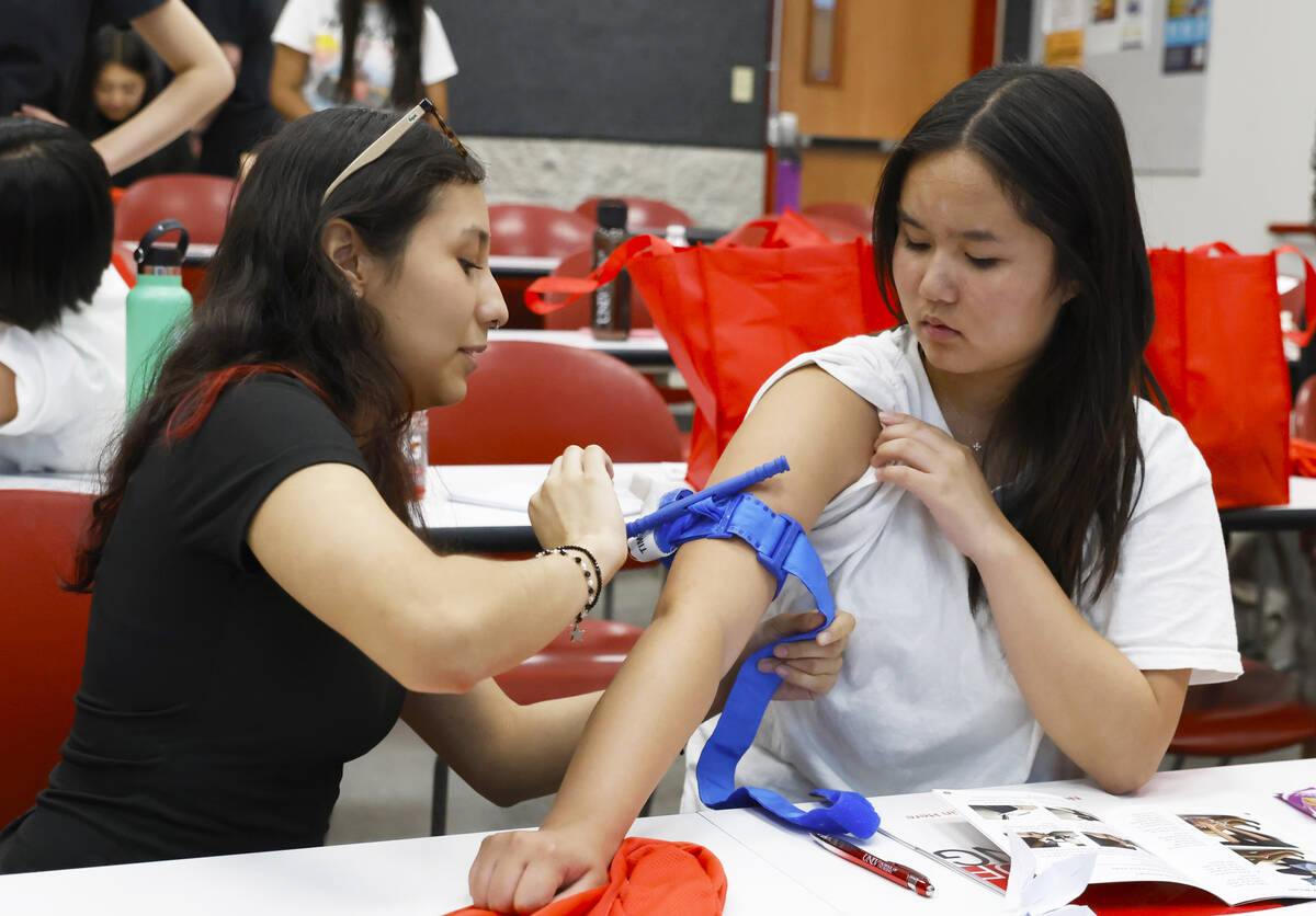 Rachel Weintraub, left, practices on Taylor Stevens to stop the flow of blood by using tourniqu ...